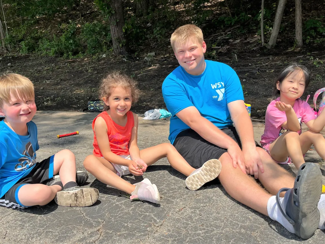 Camp at Wells Ave counselor with campers