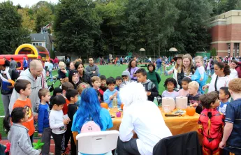 Fall Fest 2023, scientists showing group of kids experiments