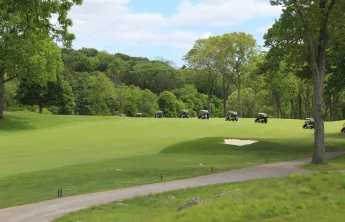 Golf carts driving on Charles River Country Club