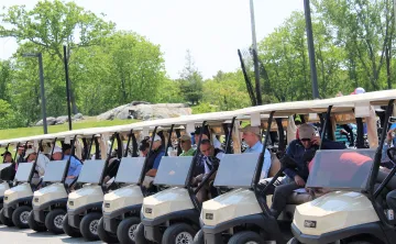 Golfers and carts lined up for the 2023 WSYMCA Annual Golf Tournament