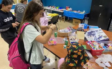 Teens doing arts and crafts at relaunch party in Church St Y