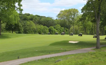 Golf carts driving on Charles River Country Club