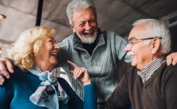 3 Active Older Adults smiling and laughing together