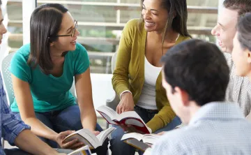 group of people discussing books for WSYMCA book club in Newton