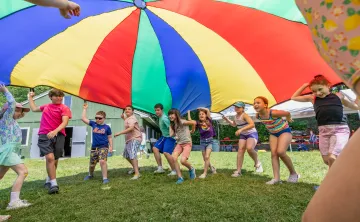 Campers at Camp Chickami playing with the parachute game