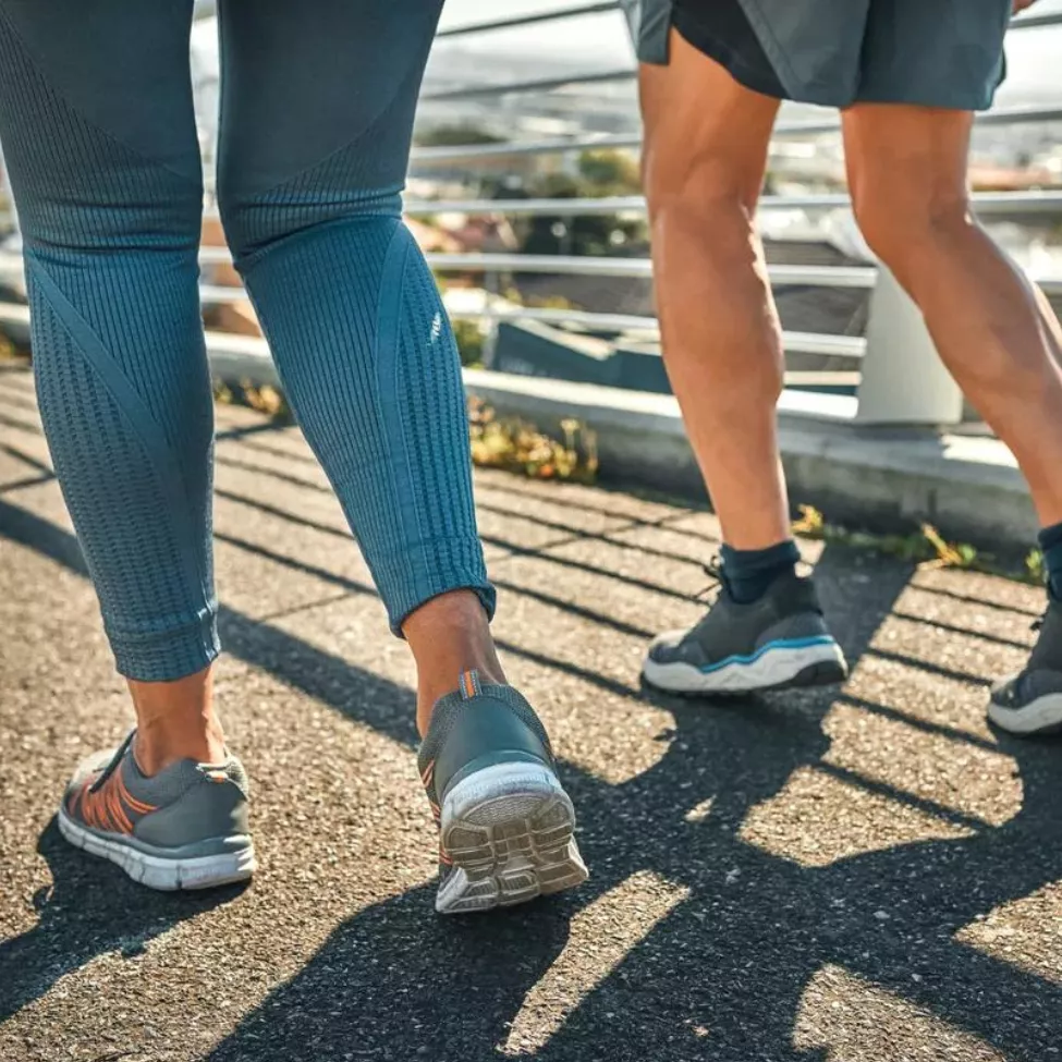 Walking works image. Two people walking outdoors.