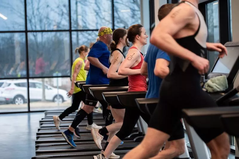 Participants in the Indoor Tri at the North Lexington YMCA run on treadmills.