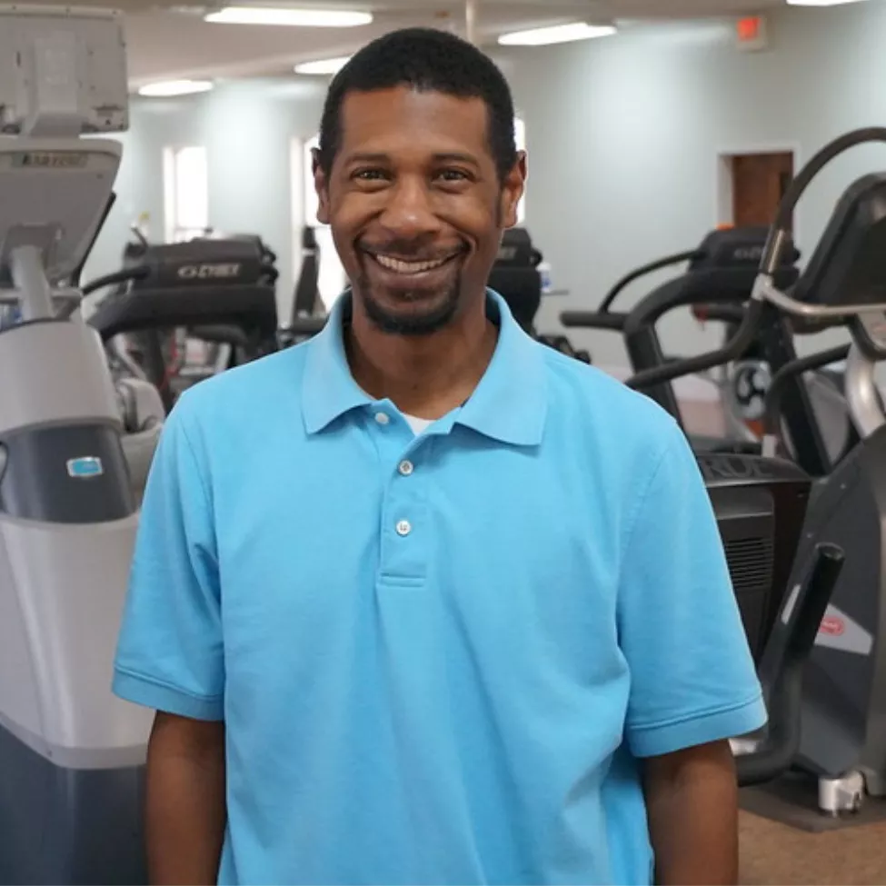 Volunteer Chris Douglas smiles at the Prevention Park YMCA