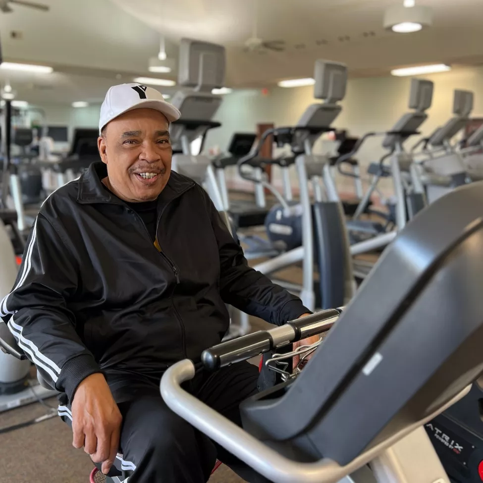 YMCA of Central KY member Ron Banks smiles on the bicycle at the Frankfort Y.