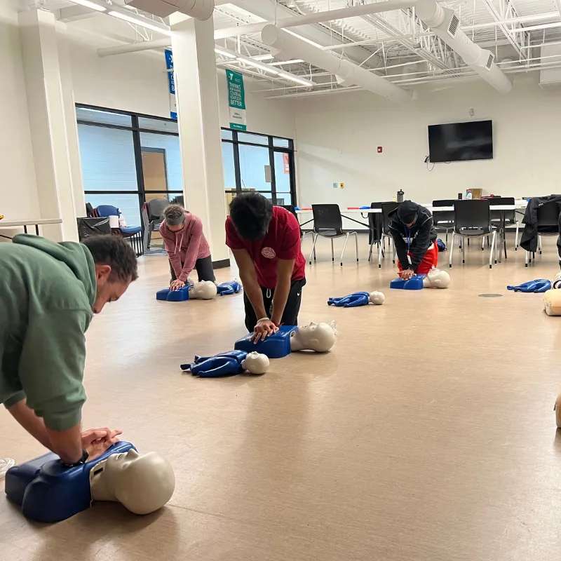 A class learned how to perform chest compressions on dummies.