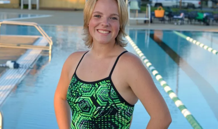 Senior Swimmer Haley M poses at the outdoor pool at the Beaumont YMCA 