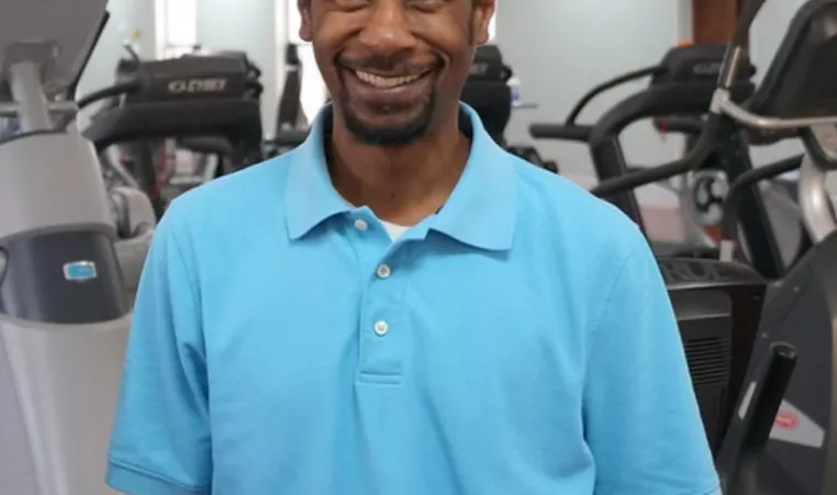 Volunteer Chris Douglas smiles at the Prevention Park YMCA