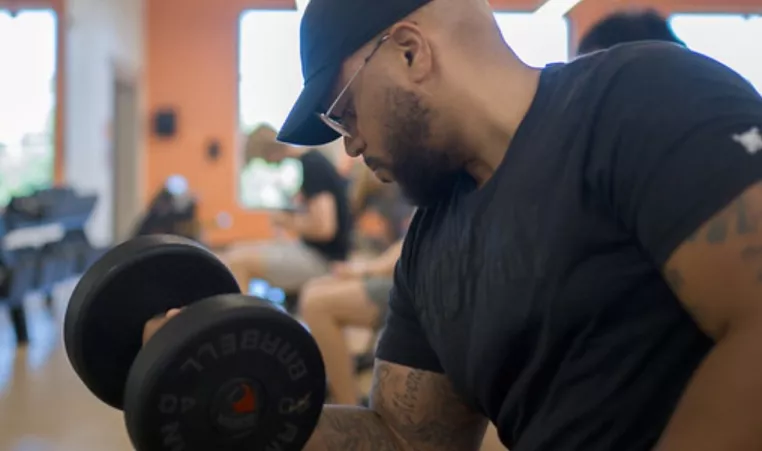 An adult man exercises at the Whitaker Family YMCA