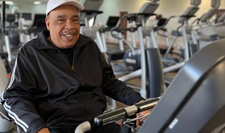 YMCA of Central KY member Ron Banks smiles on the bicycle at the Frankfort Y.