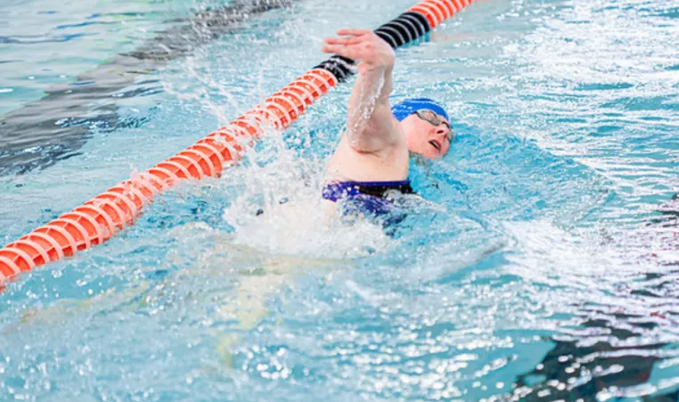 A person swims laps at the YMCA of Central KY