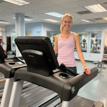 YMCA of Central KY member Anna prepares for a run on the treadmill at the High St. Y