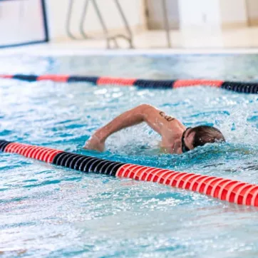 A swimmer completes lap exercise at the indoor pool at the North Lexington Family YMCA