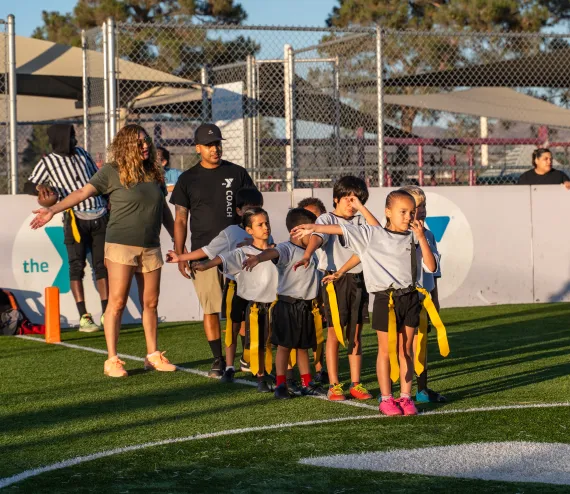 kids getting ready to give fives to the other team