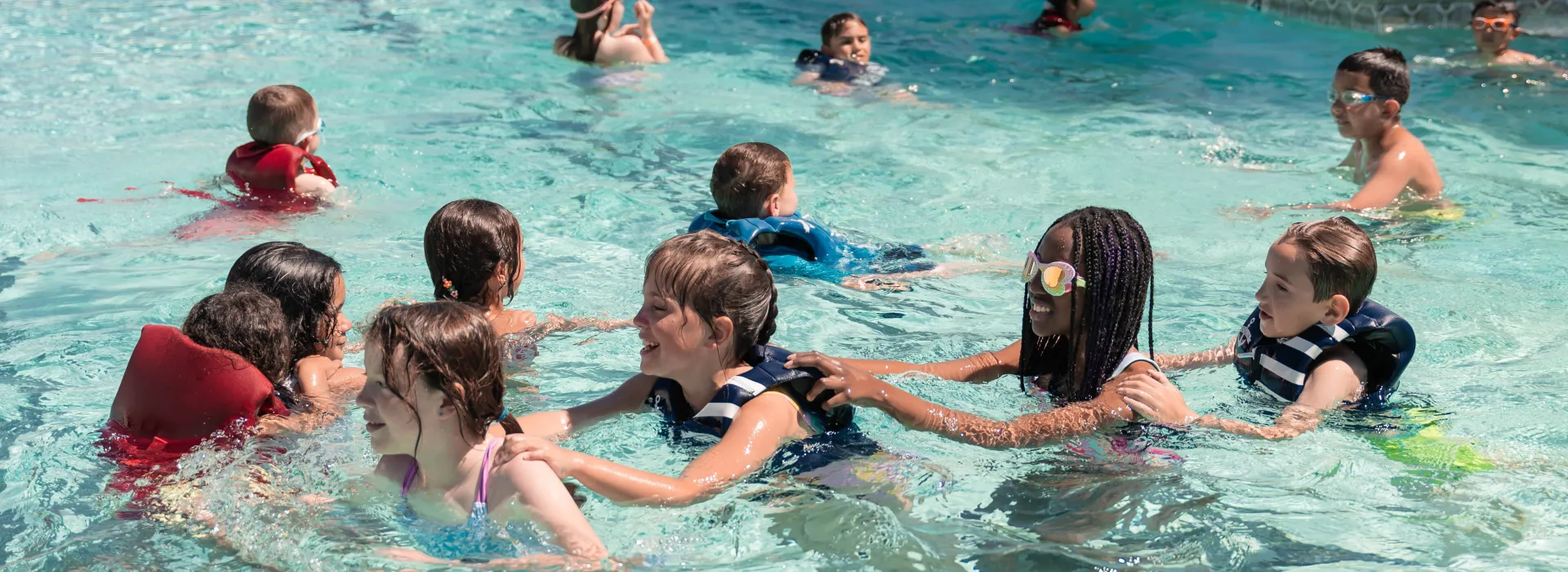 campers in line in the pool