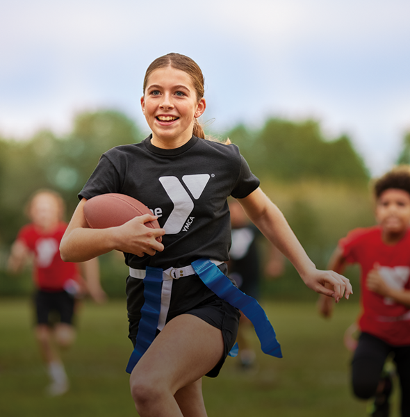 Girl playing flag football at the Y