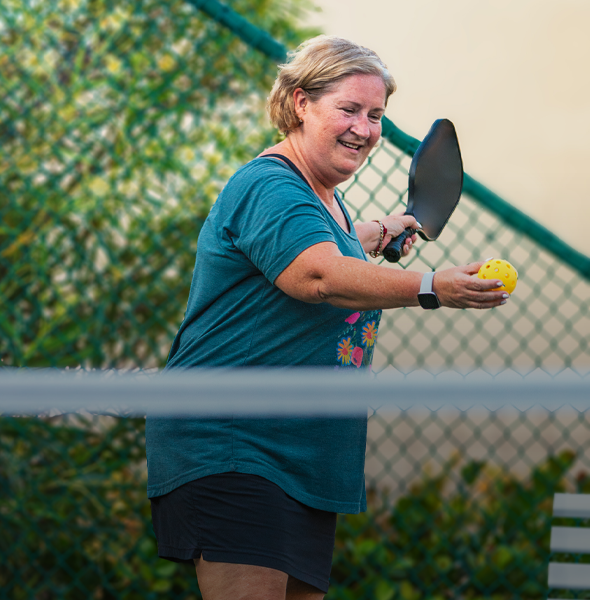 Woman playing pickleball