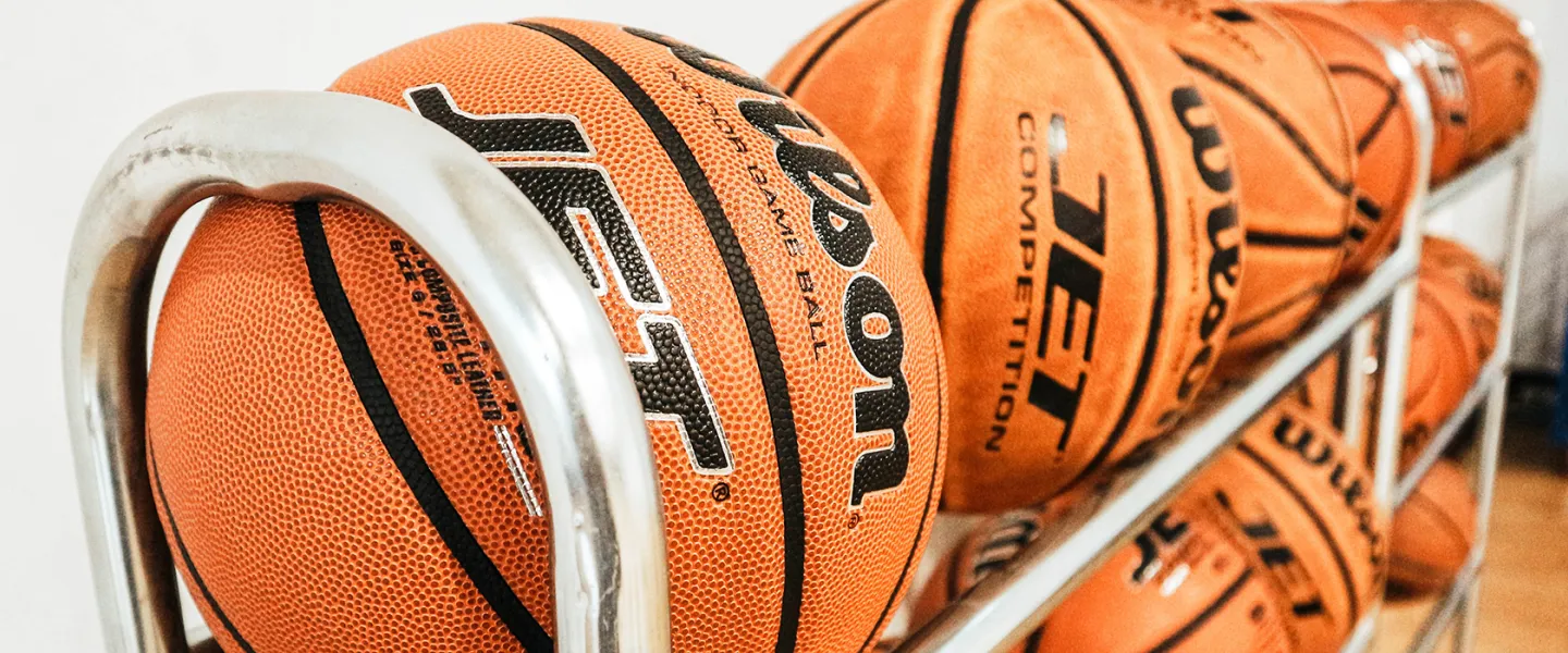 a rack filled with basketballs