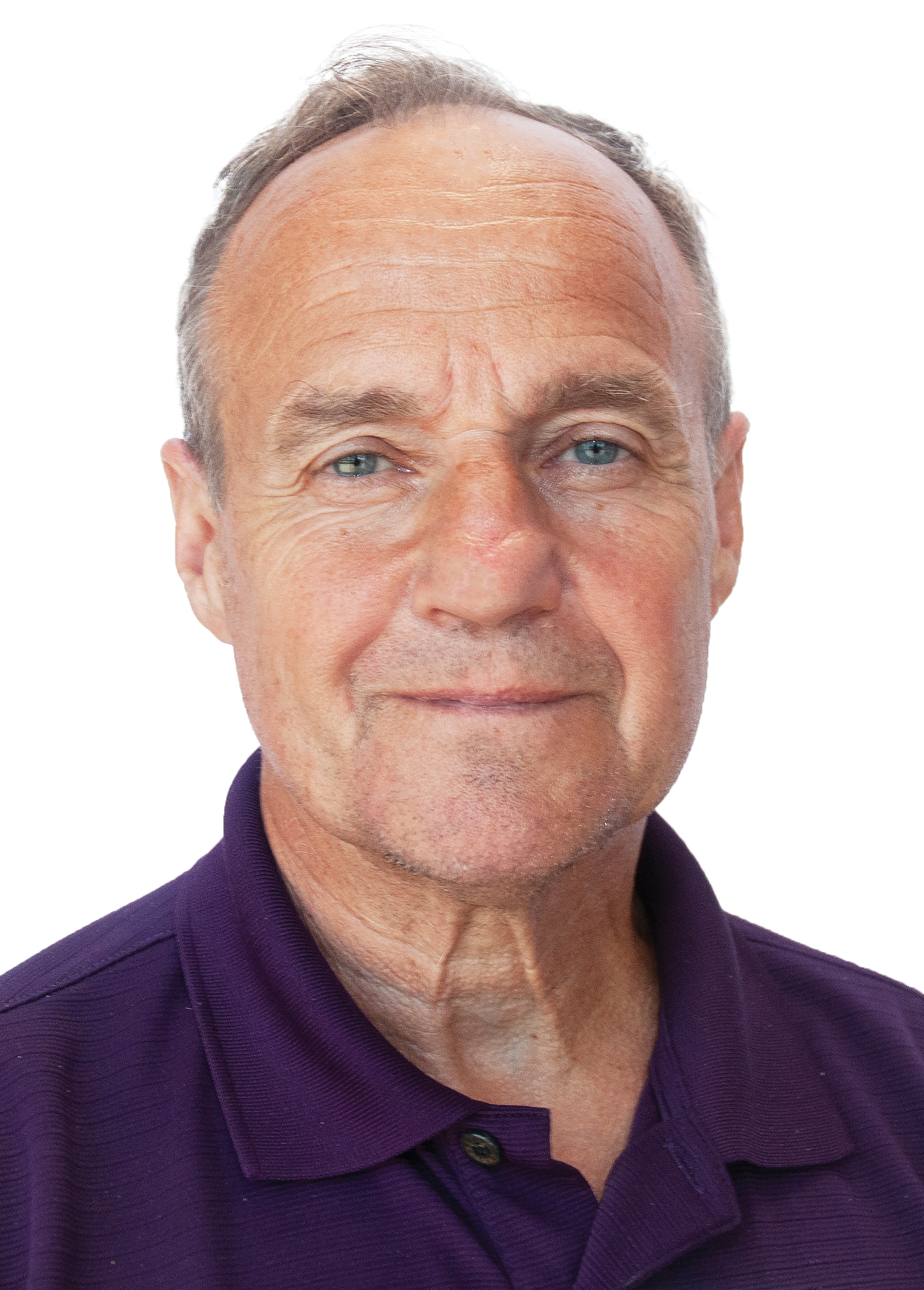 a headshot of an older man in a purple polo shirt.