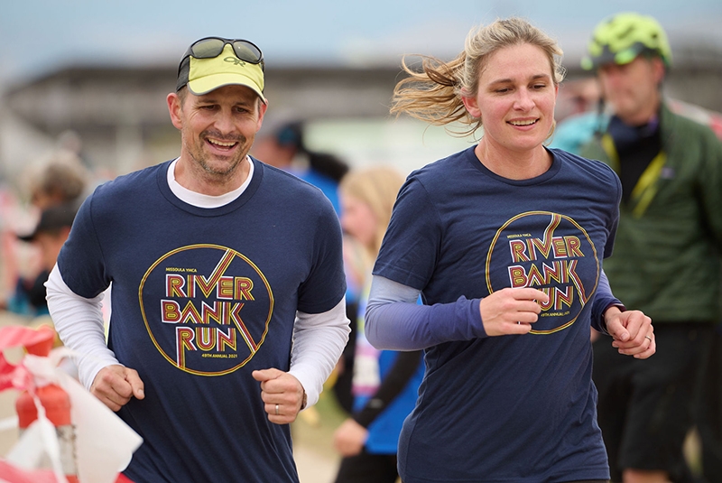 two adults running a race