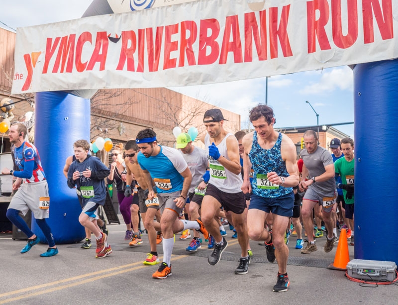 runners take off from the start line of a race
