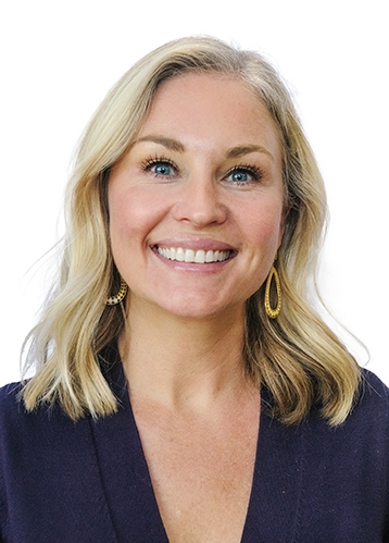 a headshot of a smiling woman with blonde hair