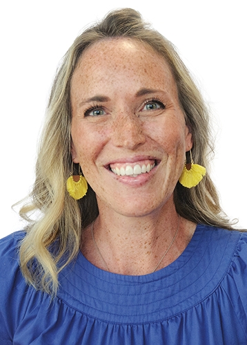 a headshot of a smiling woman with blonde hair and yellow earrings