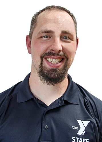 man with brown hair and brown goatee wearing a black polo with a ymca logo