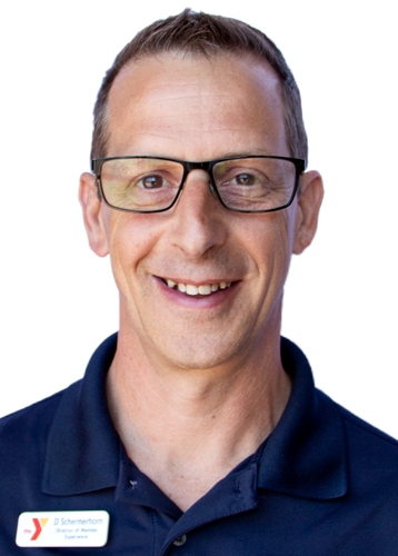 professional photo of a man in a navy polo with rectangular glasses and a ymca nametag