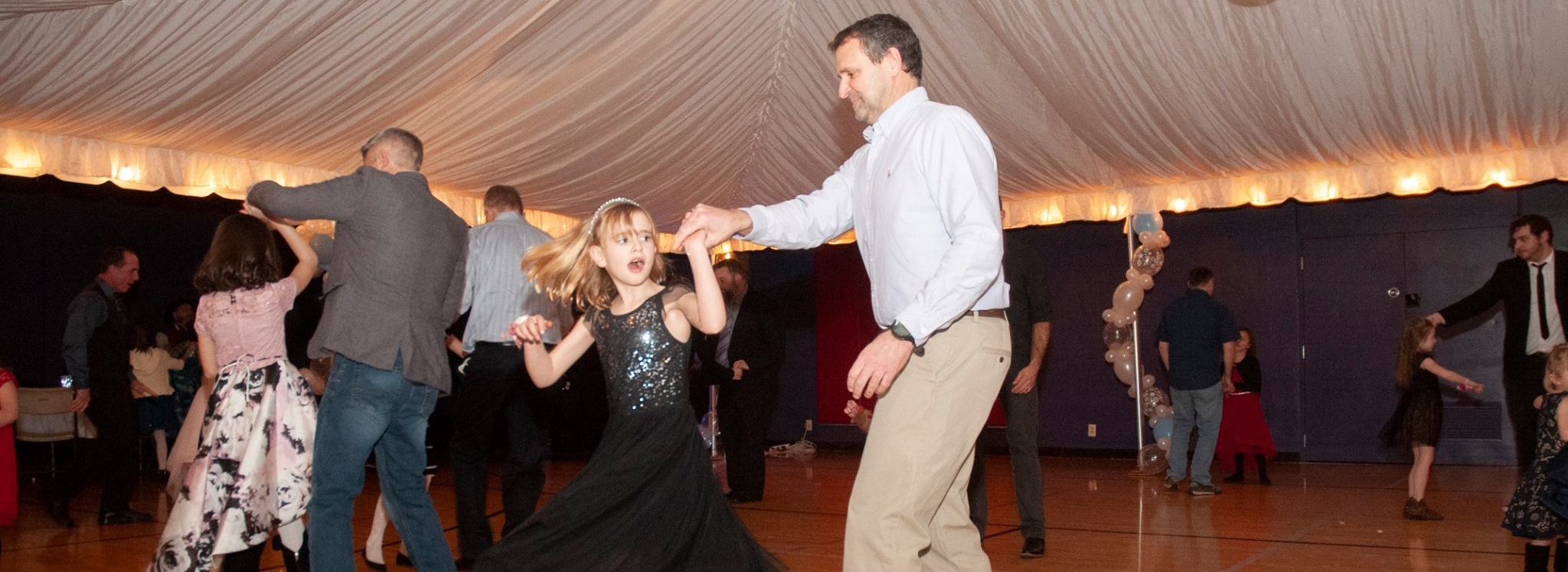 A father and daughter dance at the 2022 YMCA Sweetheart Dance